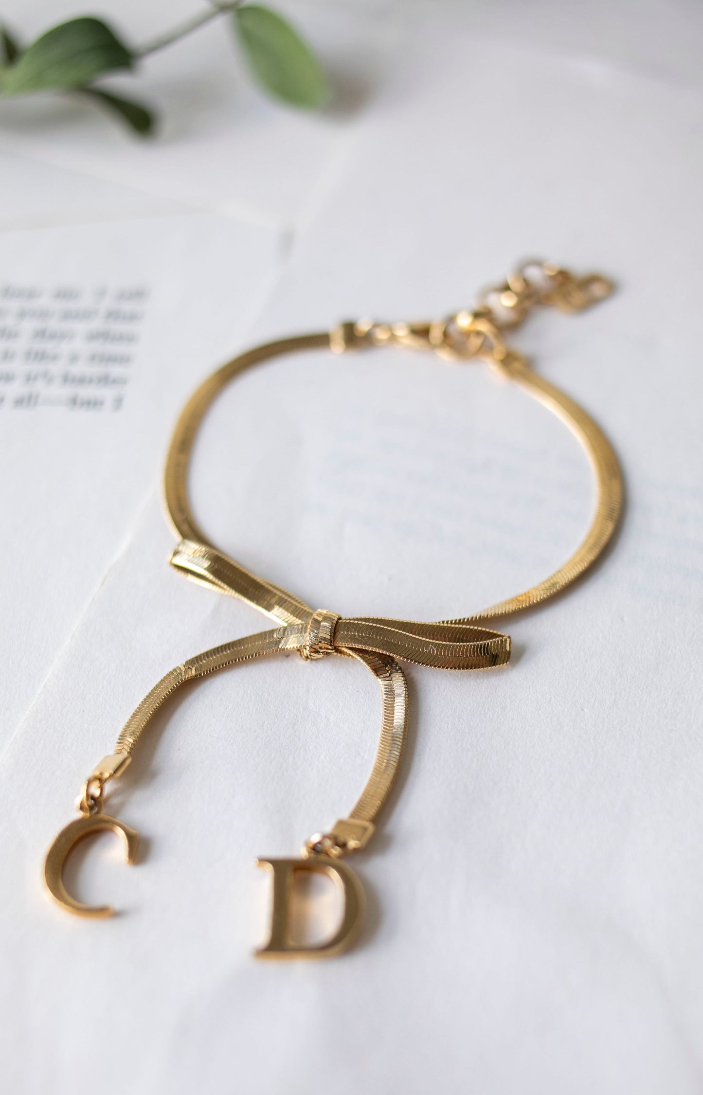 Vintage Jewelry: Gold Christian Dior CD Bow Bracelet J-CD01